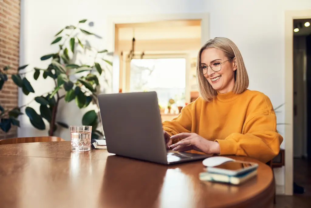 woman researches the cost of starting a new franchise in senior care industry
