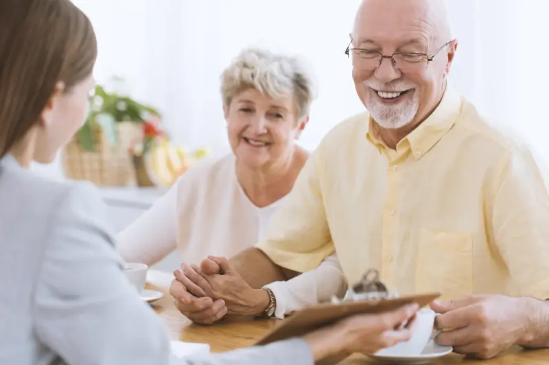 Man and woman excited about long-term care options offered by Senior Care Authority advocate