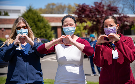 An image of 3 care staff wearing masks.