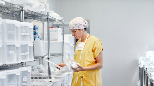 Healthcare professional in a medical store room.