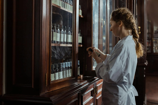 Pharmacist looking at a bottle.
