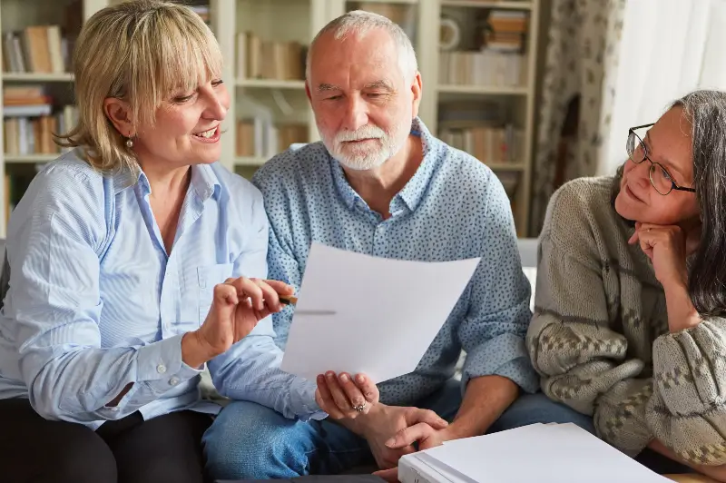 Senior Care Advisor visiting and going over information with senior clients