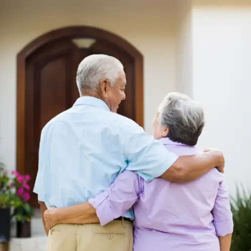 Elderly couple getting ready to enter through their Assisted Living home in Kansas City