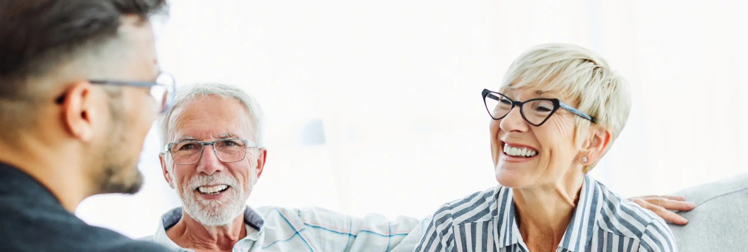 Elderly man and woman talking to a Senior Care Authority advisor in Kansas City