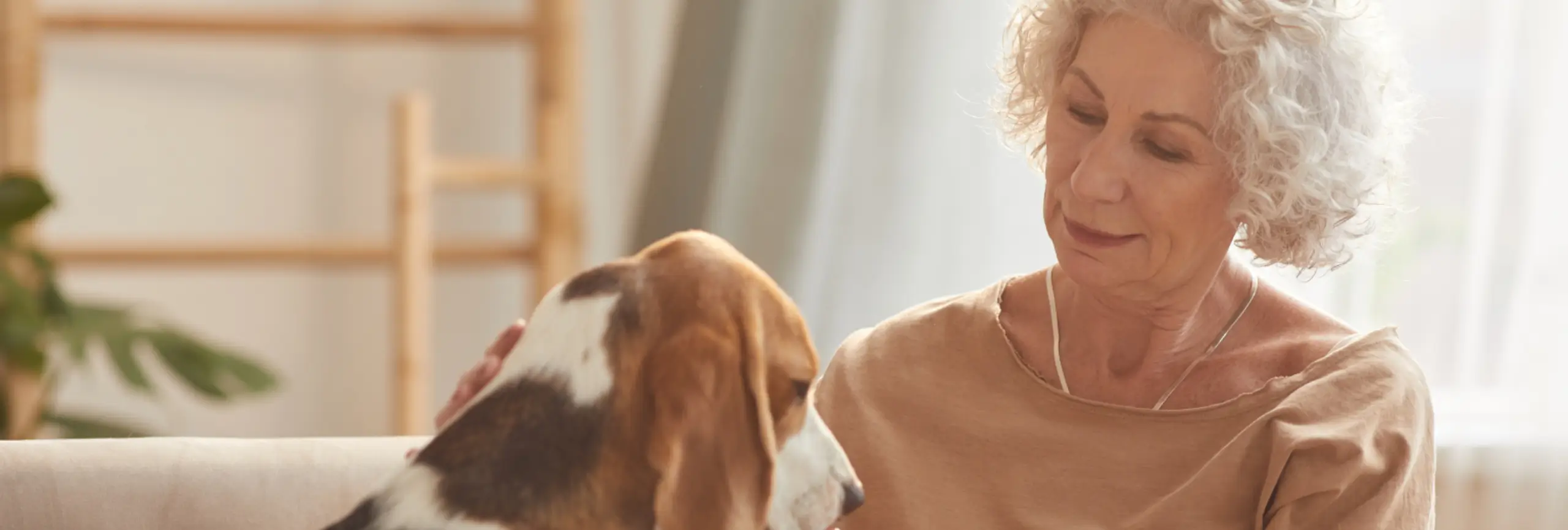 Elderly woman with a Beagle dog | Assisted Living in San Miguel