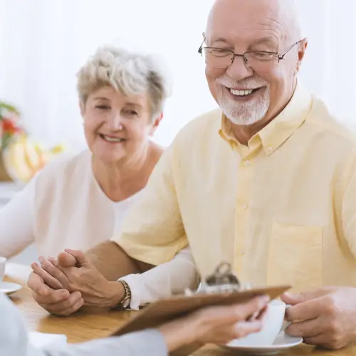 Elderly couple signing up for senior care services in River Edge