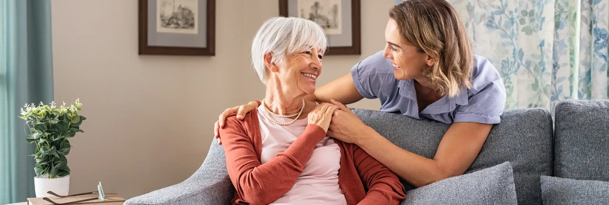 Elderly woman in an Assisted Living home in River Edge, talking to a staff member